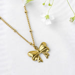 Load image into Gallery viewer, Gold Bow Pendant Necklace