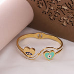 Load image into Gallery viewer, Dual Heart Evil Eye Charm Bangle – Premium Anti-Tarnish Bracelet