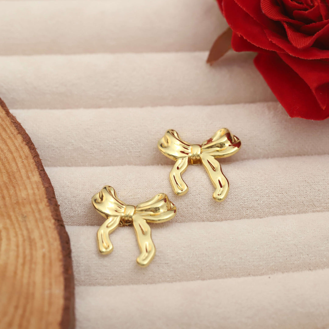 golden-bow-charm-stud-earrings-ser-238
