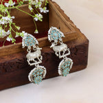 Load image into Gallery viewer, Turquoise Stones Earrings with Cow Motif
