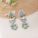 Load image into Gallery viewer, Turquoise Stones Earrings with Cow Motif
