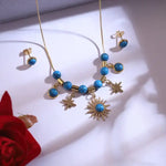 Load image into Gallery viewer, Golden Sunburst &amp; Star Charm Necklace Set with Blue Beads
