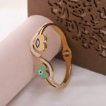 Load image into Gallery viewer, Dual Heart Evil Eye Charm Bangle – Premium Anti-Tarnish Bracelet
