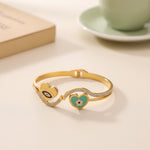 Load image into Gallery viewer, Dual Heart Evil Eye Charm Bangle – Premium Anti-Tarnish Bracelet
